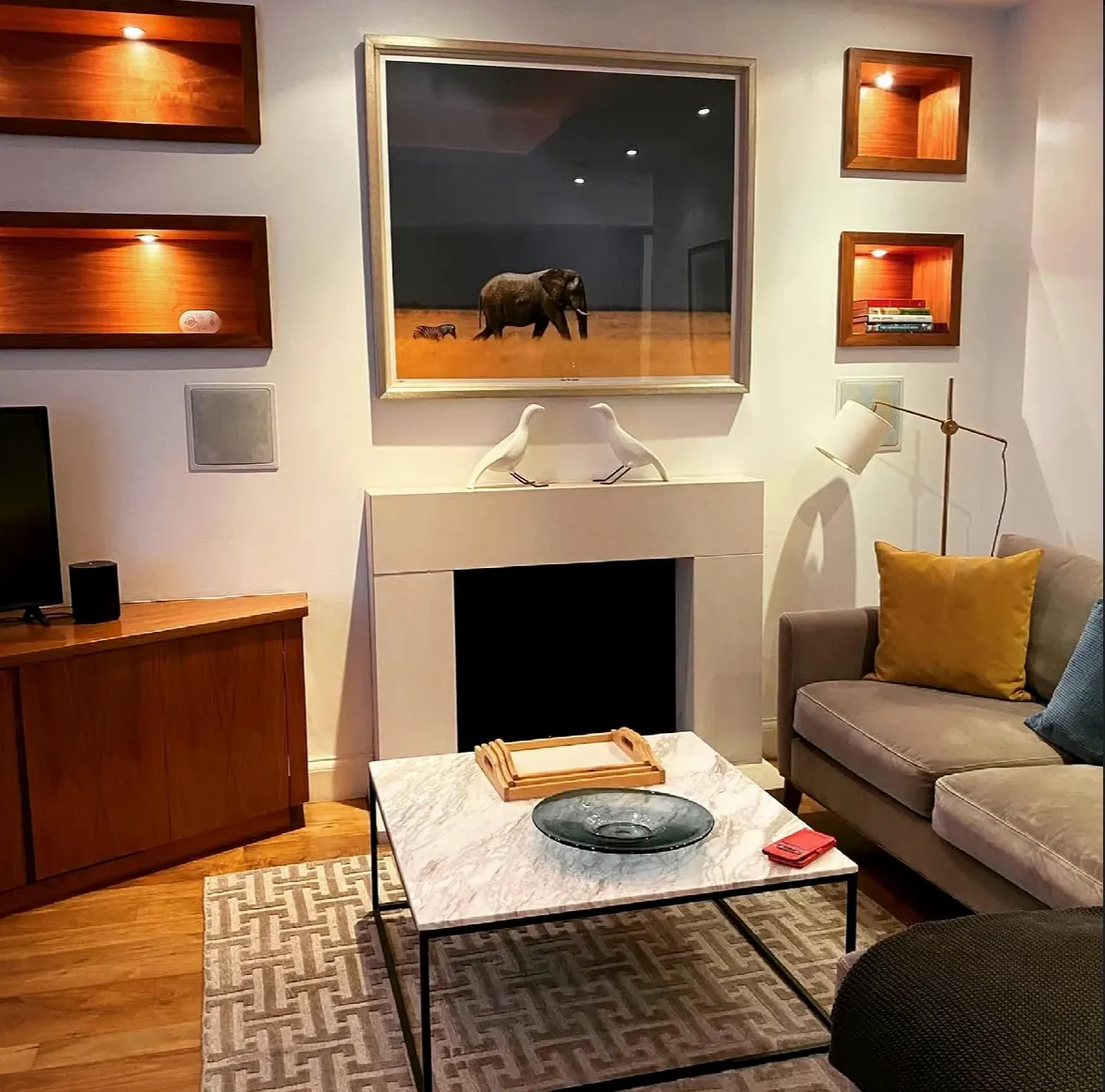 Clean private sitting room with fireplace